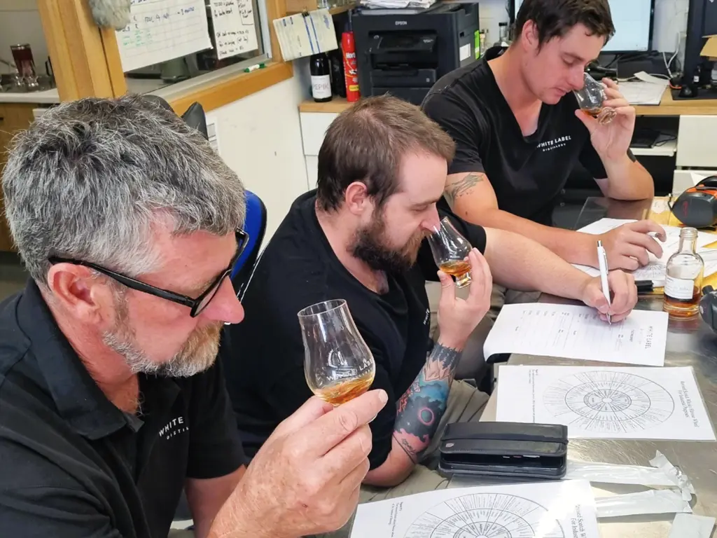 the expert team at the white label distillery conducting whisky testing